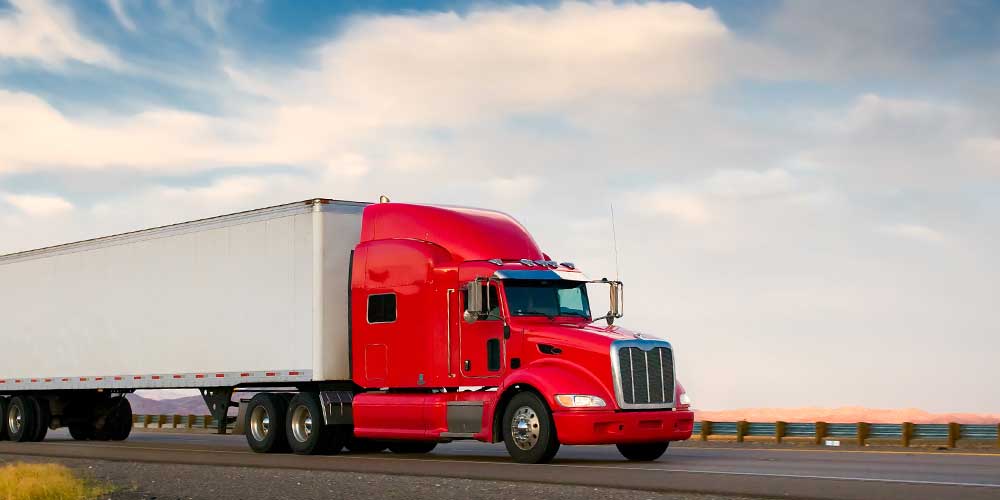 Red semi truck on highway