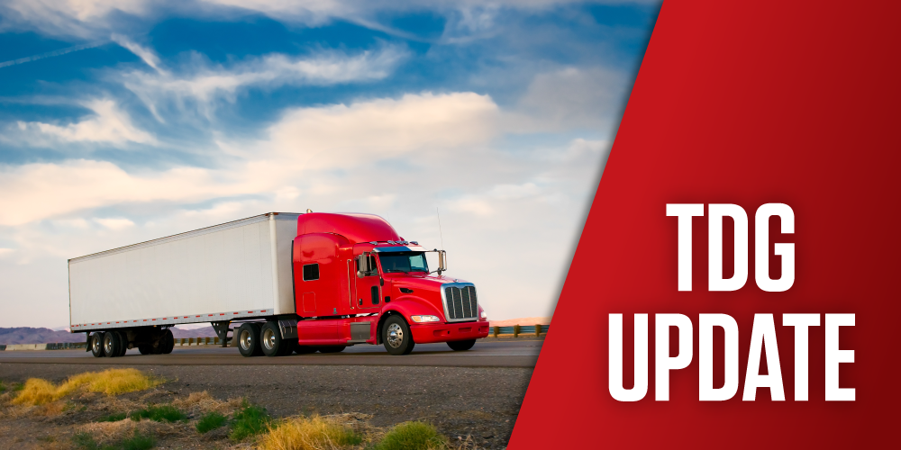 Red and white semi truck on the highway